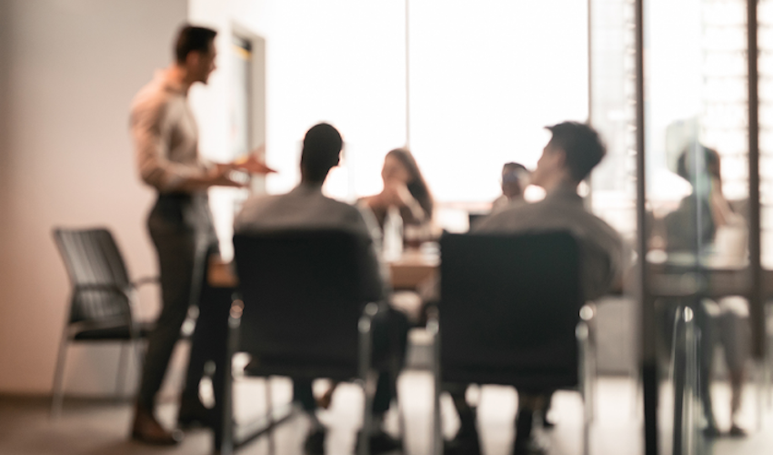 people sitting around a conference table